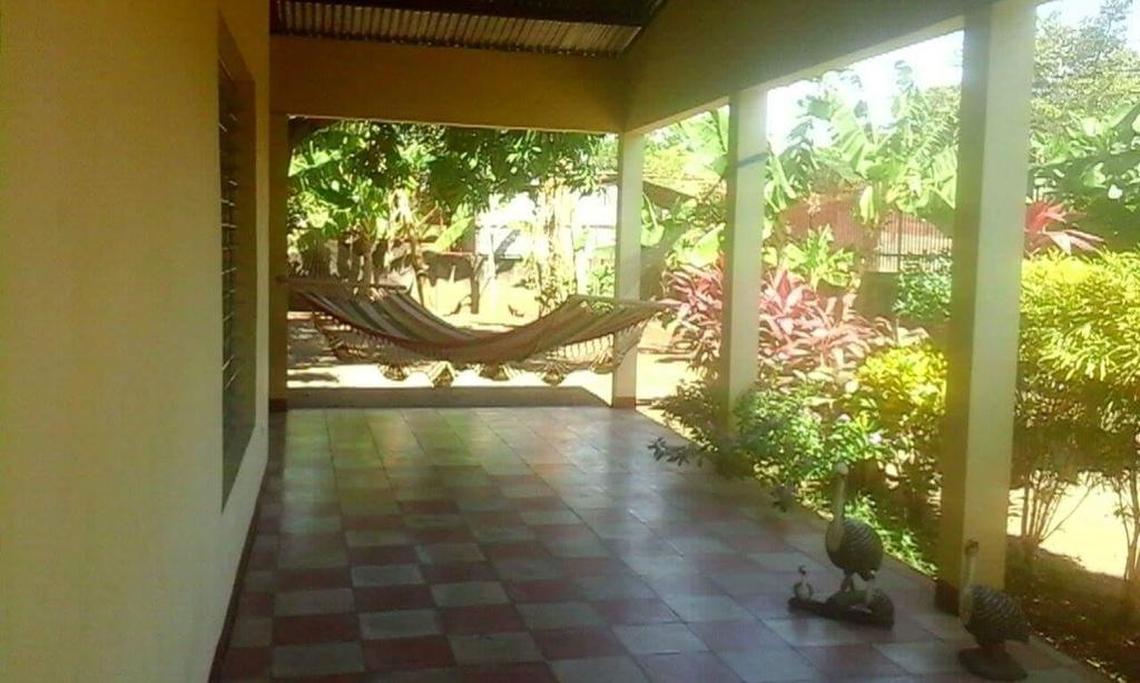 Orfilia Montalvan, 69, retired to Granada, Nicaragua, from Miami. This is her backyard porch in her four-bedroom home. She has about a dozen fruit trees in her backyard.