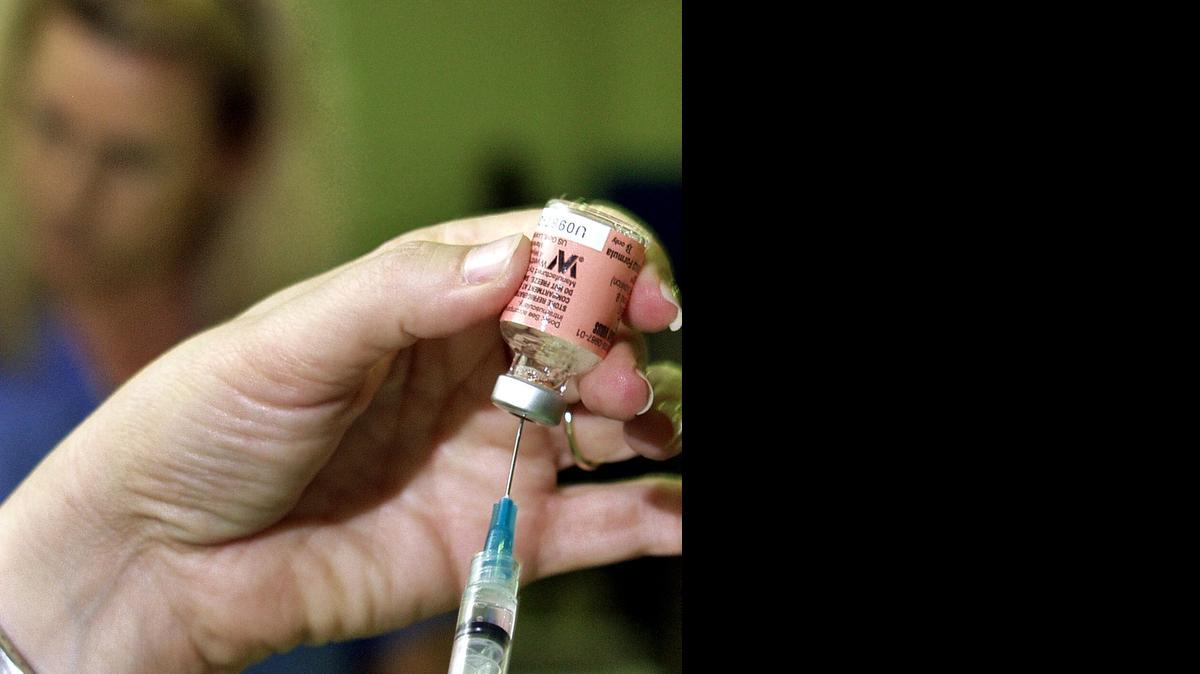 
The steady hands of Liz Gassew, RN, prepare one of nearly 800 free flu shots given free to Plantation seniors and the chronically ill at the Central Park Gym. 
