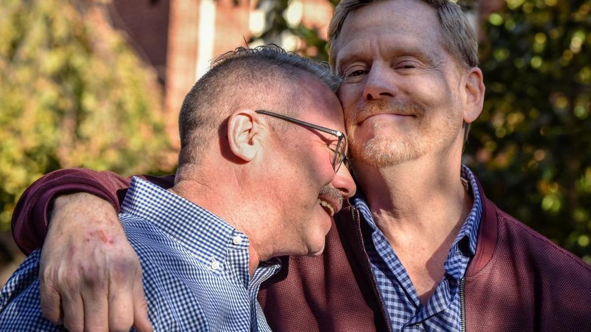 Mark King, at home with husband Michael Mitchell, left, is a writer and activist in Baltimore.