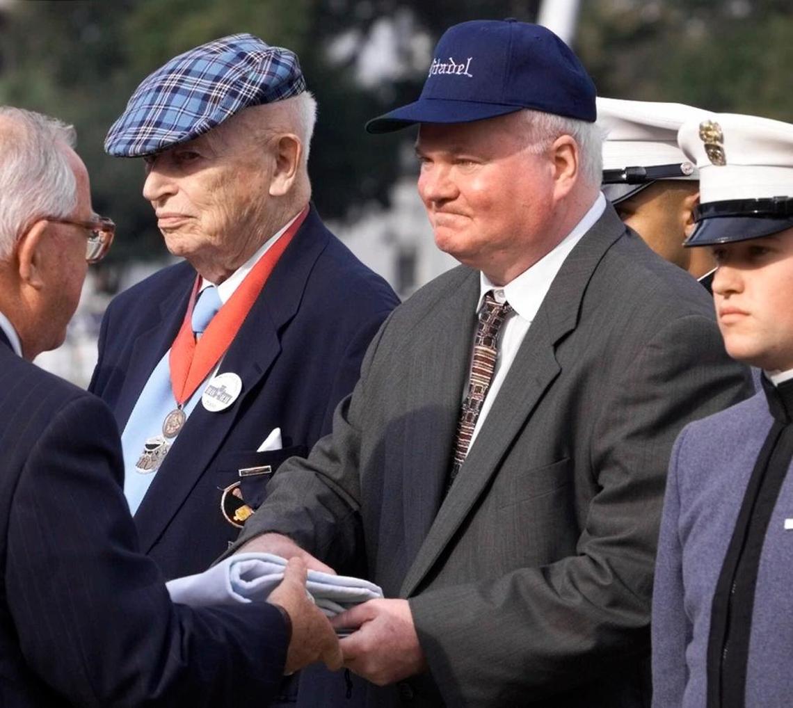 In this Oct. 20, 2000 file photo, author Pat Conroy receives an honorary doctor of letters degree during a ceremony on the parade grounds of The Citadel, in Charleston, S.C. Conroy had graduated from The Citadel. He wrote the novel, “Lords of Discipline,’’ a harrowing tale of hazing and racism at a fictional military college based in Charleston.