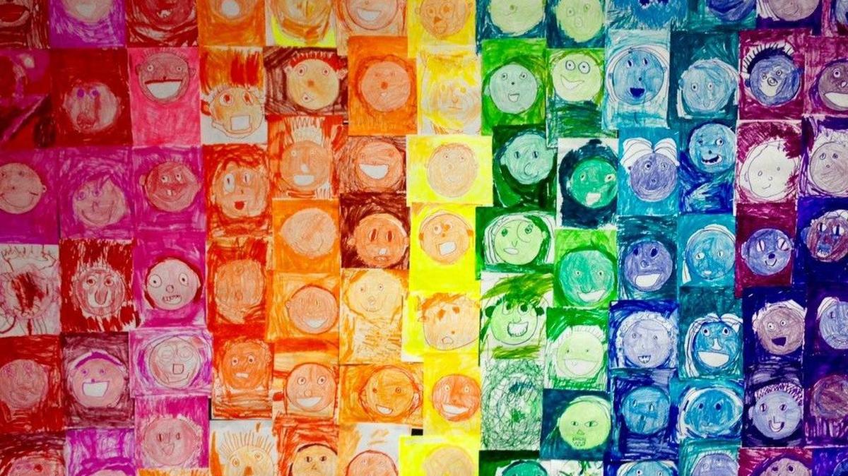 This gallery of faces was drawn by a group of first graders.