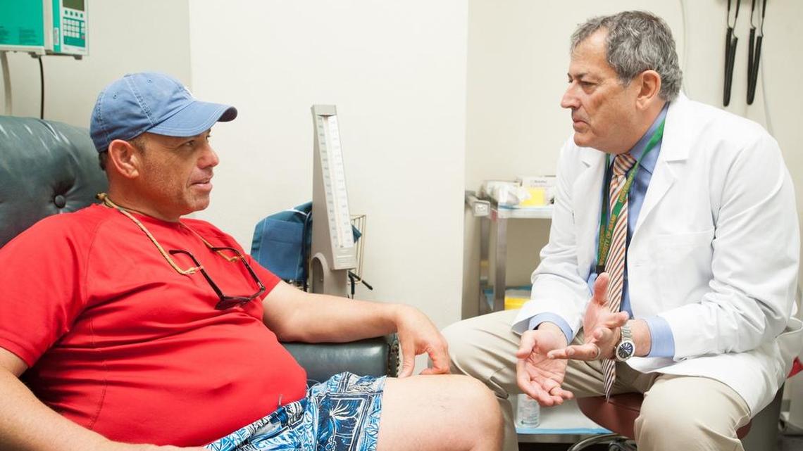 Rick Dronsky, of Cooper City, discusses a clinical trial with Dr. Jay Skyler of the Diabetes Research Institute.