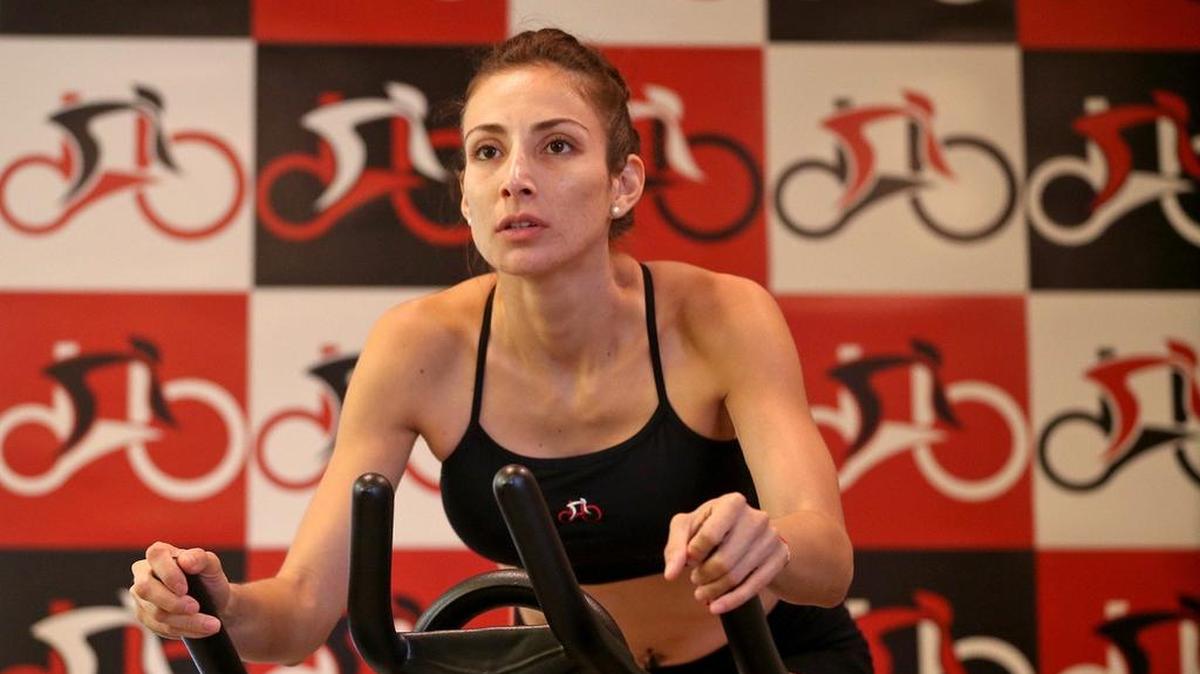 Instructor Mari Espinoza gets in a workout at Albert Ghitis' indoor cycling studio, Red Bike, on Thursday, December 22, 2016. Red Bike is a family owned business in Brickell.