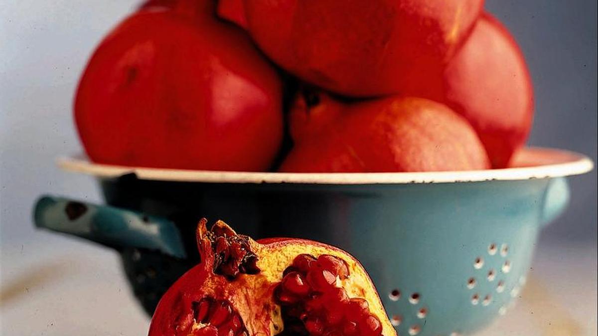 KRT FOOD STORY SLUGGED: SHELF KRT PHOTOGRAPH VIA CHICAGO TIRBUNE (KRT106-November 24) Decorative pomegranates turn up in fall, just in time for the holidays. This ancient fruit represents fertility, hope and prosperity. At market, buy plump fruit that are heavy for their size and have skin that's bright to deep red. They will keep for days at room temperature, and several weeks in the refrigerator.