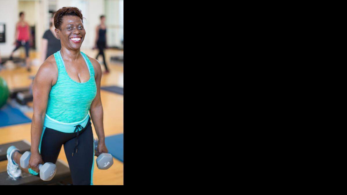 
IN SOLID SHAPE: Anne Auguste, above, who works at Sylvester Comprehensive Cancer Center, takes exercise classes twice a day at the UHealth Fitness & Wellness Center. Left, Timothy Soler works out at the center with three friends, starting at 4:15 a.m.



