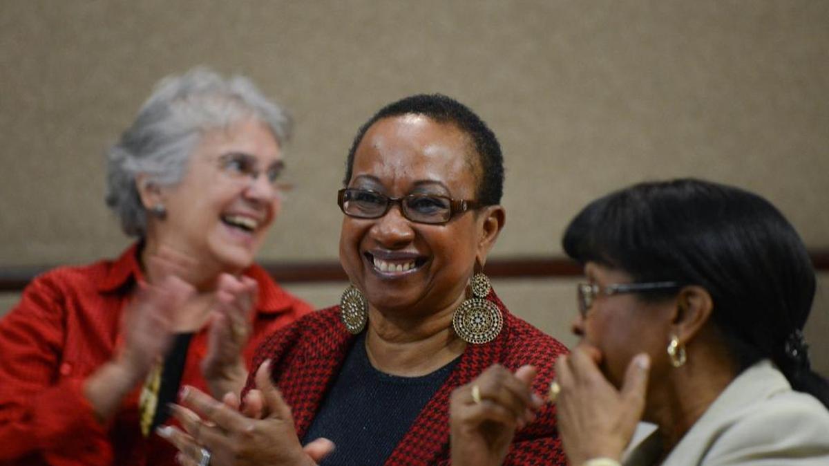 WomenHeart Champion Loren Welch, center, laughs after a speech given at her Womenheart support group for women with heart disease at Baptist Health South Florida. Aurora Gonzalez, 80, is at left. Welch, 62, had a heart attack at age 60.