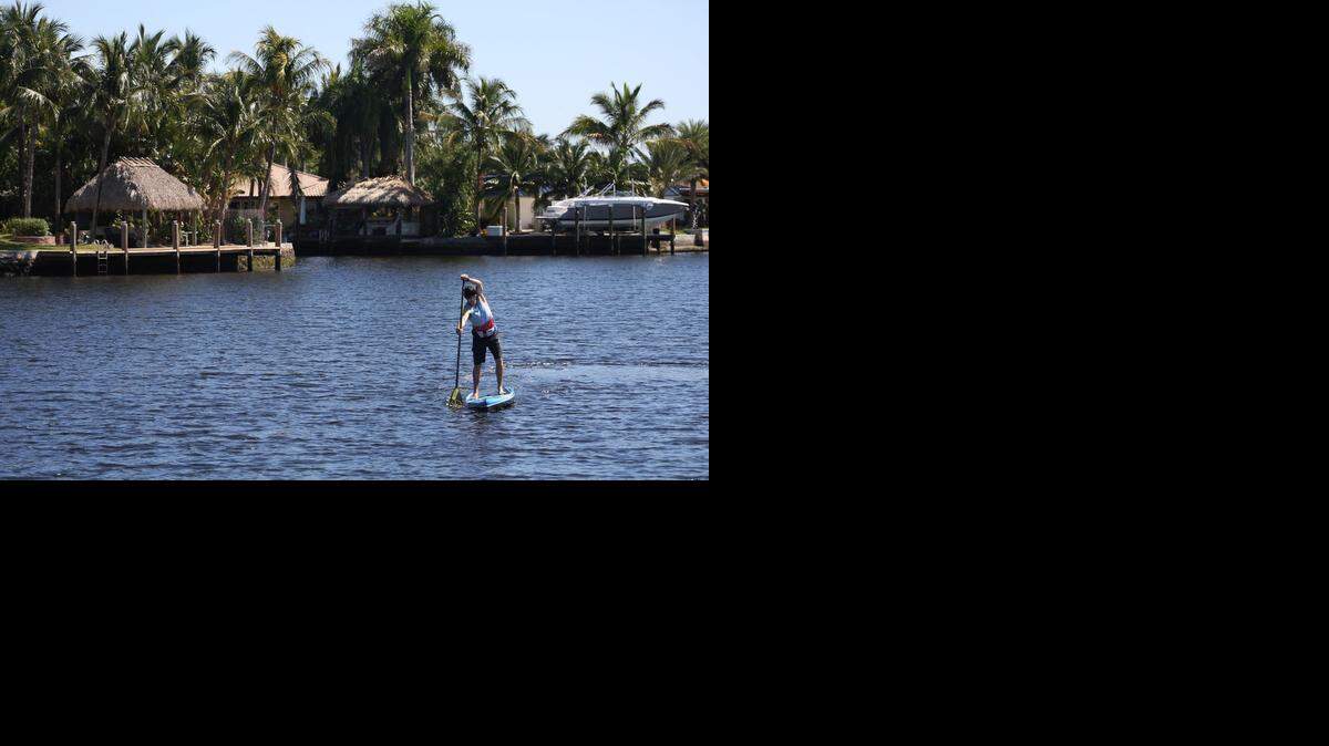 
Charlie Howden trains inside the waterway near his home as the Wilton Manors cancer patient, Howden, is raising money for a cancer research foundation by paddling down the Costa Rican coastline in April.
