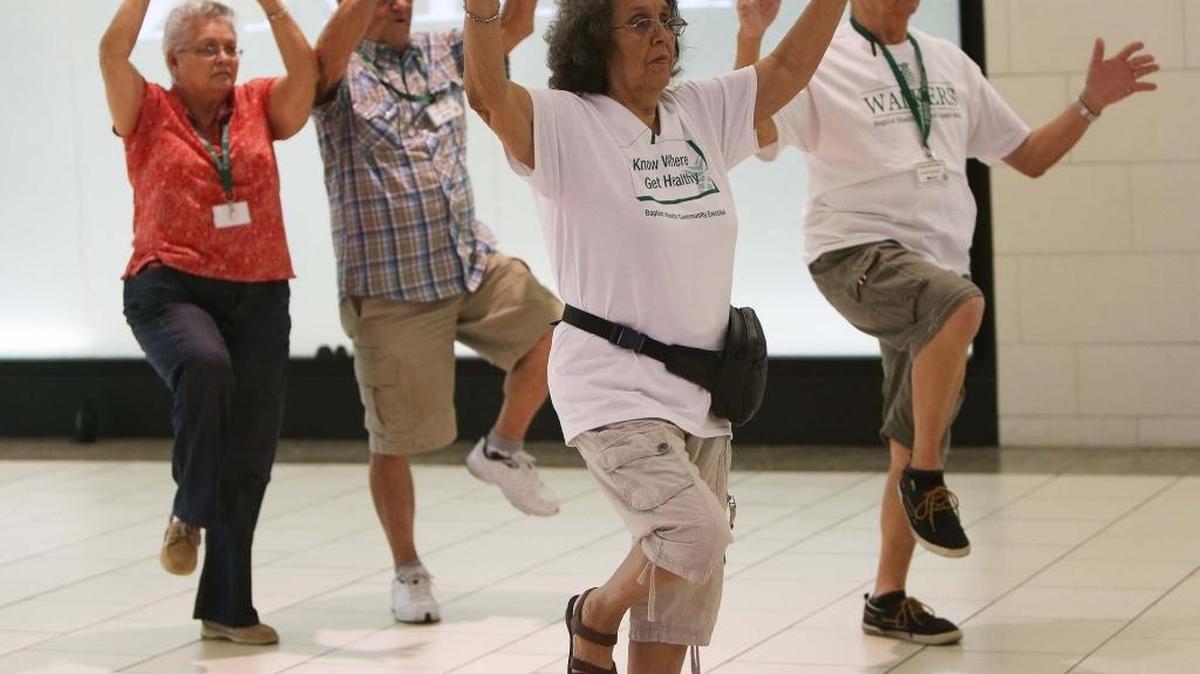 Hildelisa Rodriguez, 77, (center) along with her husband Robert Rodriguez, 78, (right) and Elsa Miralles, 77, (left) and her husband Humberto Miralles, 83, warm up along with other members of the group before walking at Dadeland Mall. Brisk walking on a regular basis helps pump blood to your brain, which can help retain cognitive skills as you age.