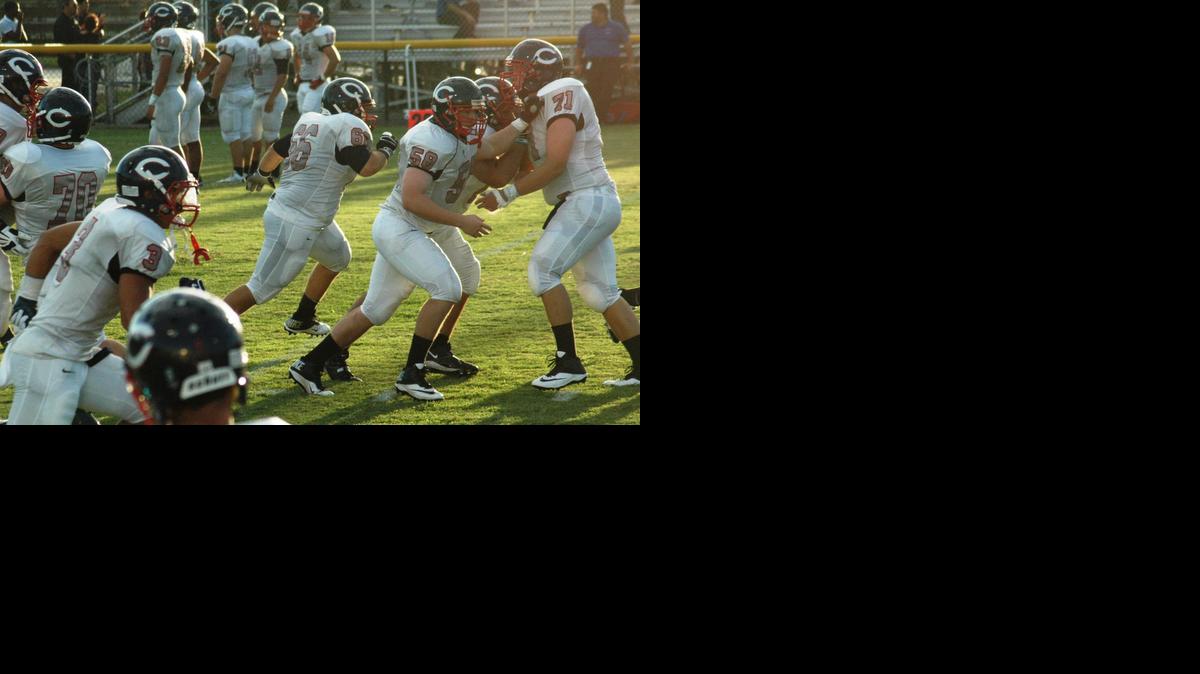 
Daniel Angulo, last year a center for the Christopher Columbus football team, (Number 66), runs a play at a game against American Heritage School. 
