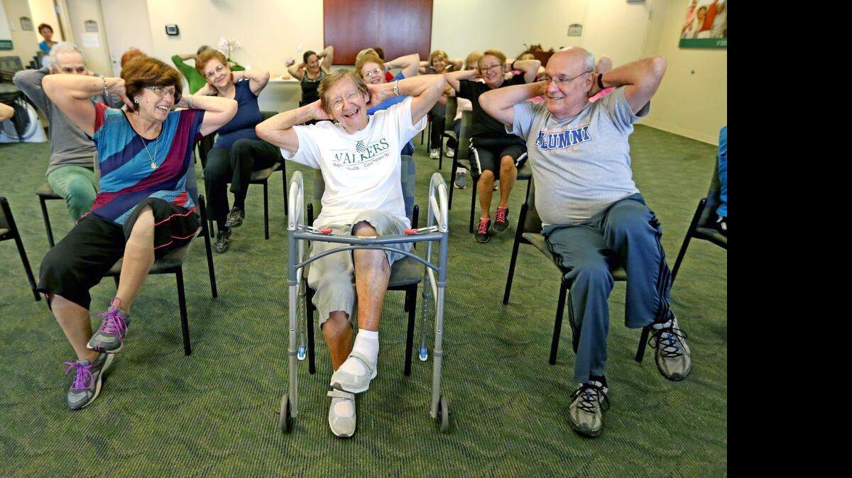 STEP BY STEP: Edith Meister 90, center, is recovering from surgery and taking aerobic classes at Baptist Medical Plaza in Westchester.