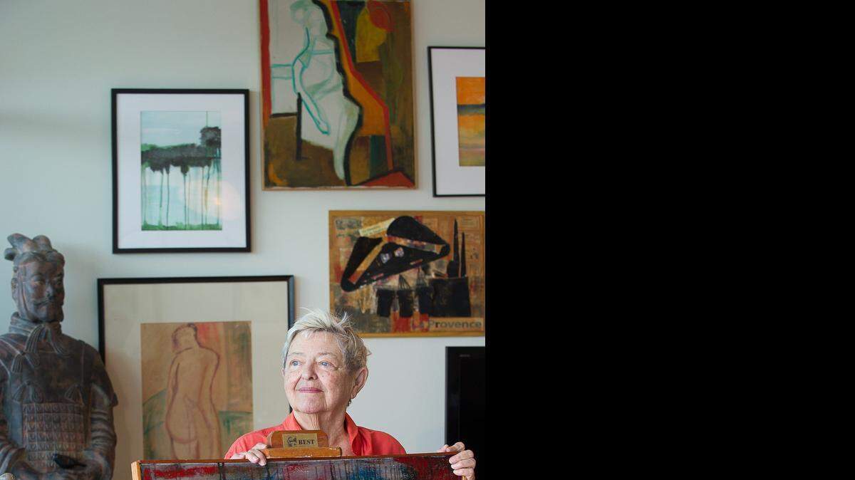 
BACK ON HER FEET: Charmaine Gibson with one of her paintings after hip-replacement surgery. She’s now able to climb stairs and go for daily walks.
