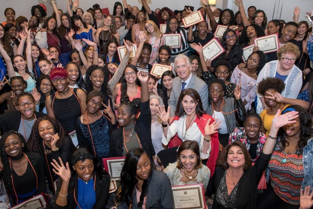 Jennifer Valoppi and Don Browne with Women of Tomorrow graduates in the spring of 2017.