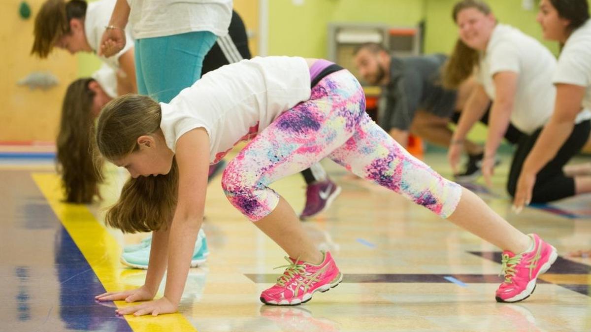 Carolina Garcia of South Miami, then age 11, and others exercise as part of the Healthy Chicas wellness program at Nicklaus Children's Hospital in Three Lakes, Friday, Jan. 15, 2016.