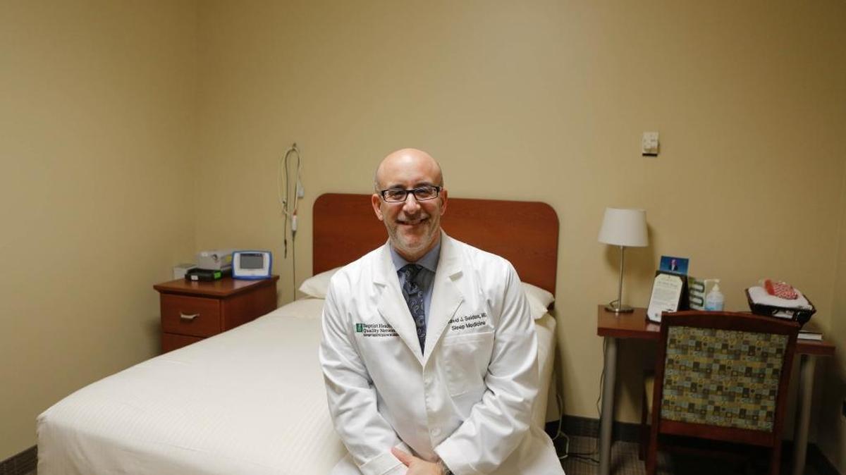 Dr. David Seiden, medical director of Baptist Sleep Center in Hollywood, sits for a portrait in one of his sleep lab’s bedrooms where patients spend the night to be tested on Friday, Aug. 19.