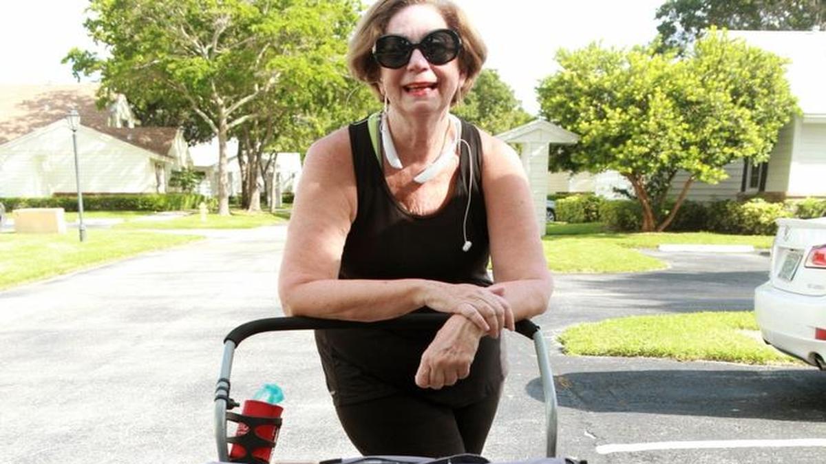 Breast cancer patient Yvonne Meyers walks with her three dachshunds. She has lost 27 pounds since her diagnosis.