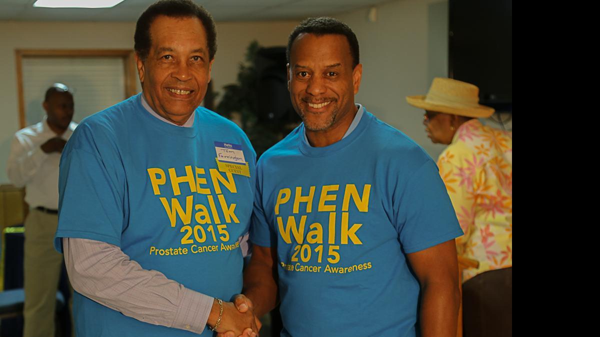 
Reaching out: Thomas Farrington, left, and Rev. Byron E. Thomas, Ben Hill United Methodist Church in Atlanta, at PHEN symposium in May in Atlanta.

