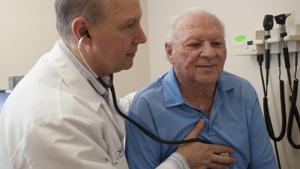 Dr. Jose Lutzky, director of the melanoma program at Mount Sinai Comprehensive Cancer Center, meets with his patient Herbert Schwartz. Schwartz had a melanoma removed from his leg.