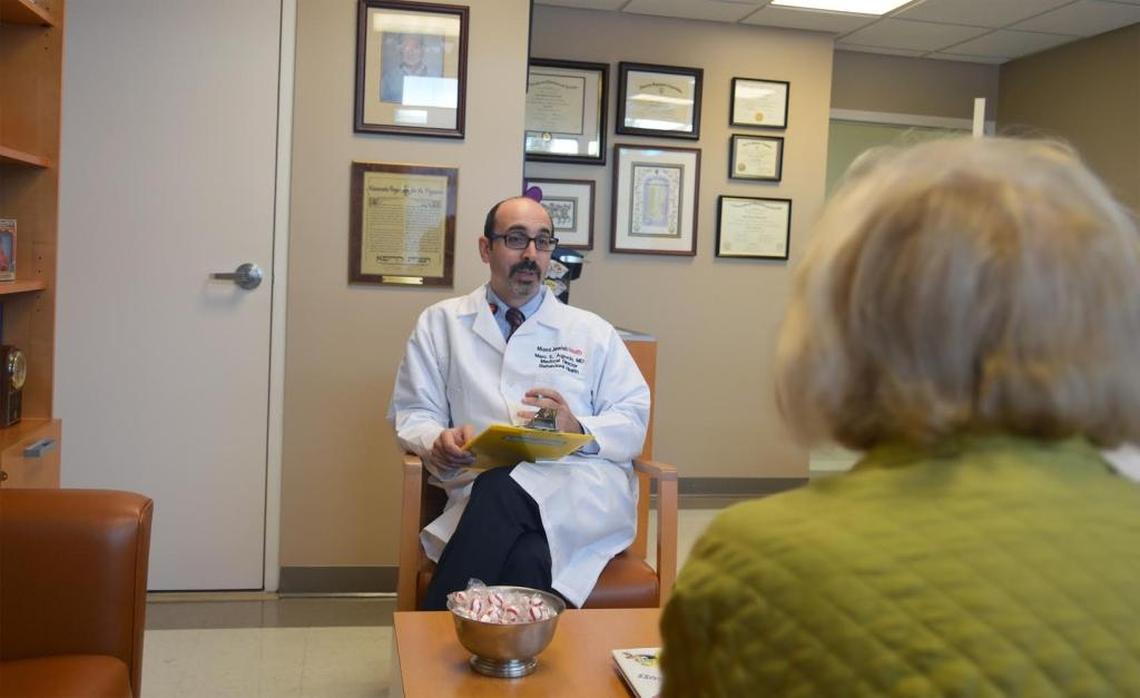 Dr. Marc Agronin, a board-certified geriatric psychiatrist and medical director at Miami Jewish Health Systems, consults with a senior on memory issues.