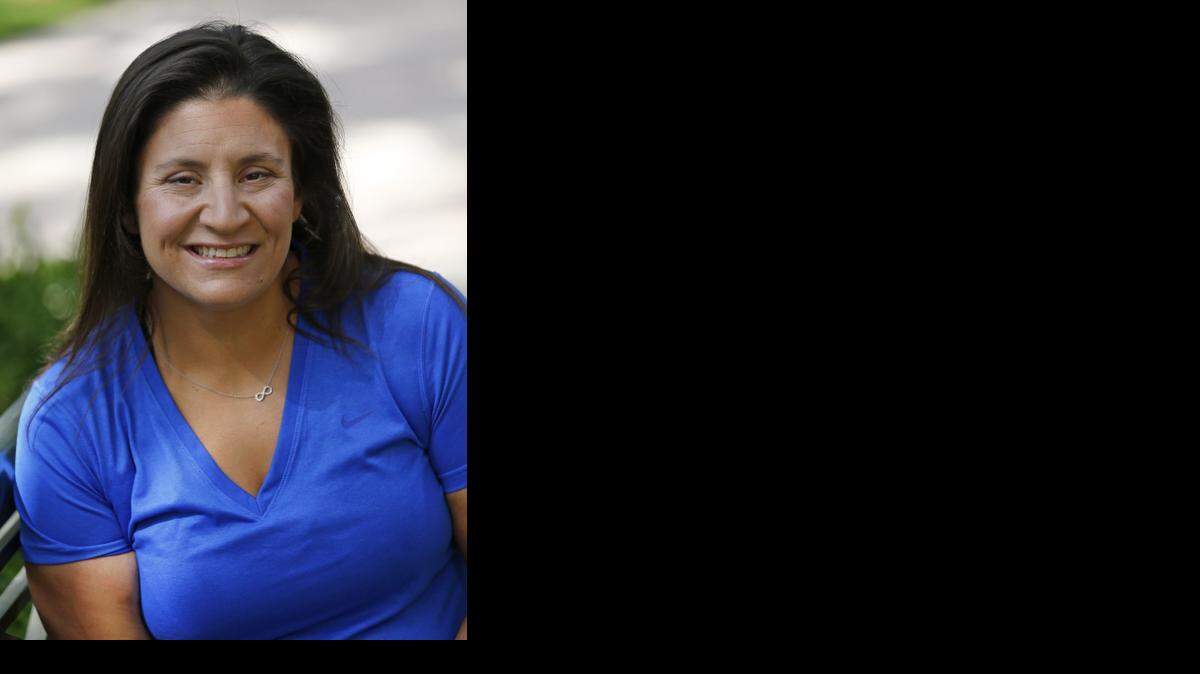 Dedicated:  Nelly Farra works out for an hour five days a week and for two hours on Saturdays, when she does two of the three: a 10- to 12-mile bike ride, a half-mile swim or a four-mile run.