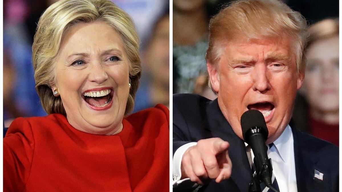 This combination of photos taken at late-night campaign rallies shortly after midnight on Tuesday, Nov. 8, 2016, shows Democratic presidential candidate Hillary Clinton in Raleigh, N.C., and Republican presidential candidate Donald Trump in Grand Rapids, Mich.