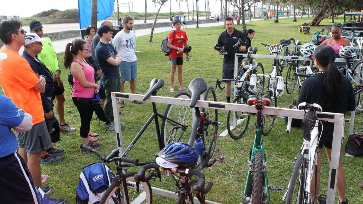 Try Jacobson, instructor with the South Beach Triathlon, talks to some of the participants training for the event on on April 3. They are working out on Saturday, March 5, 2016, at Lummus Park. They are training with Frankie Ruiz, who co-founded the Miami Marathon.