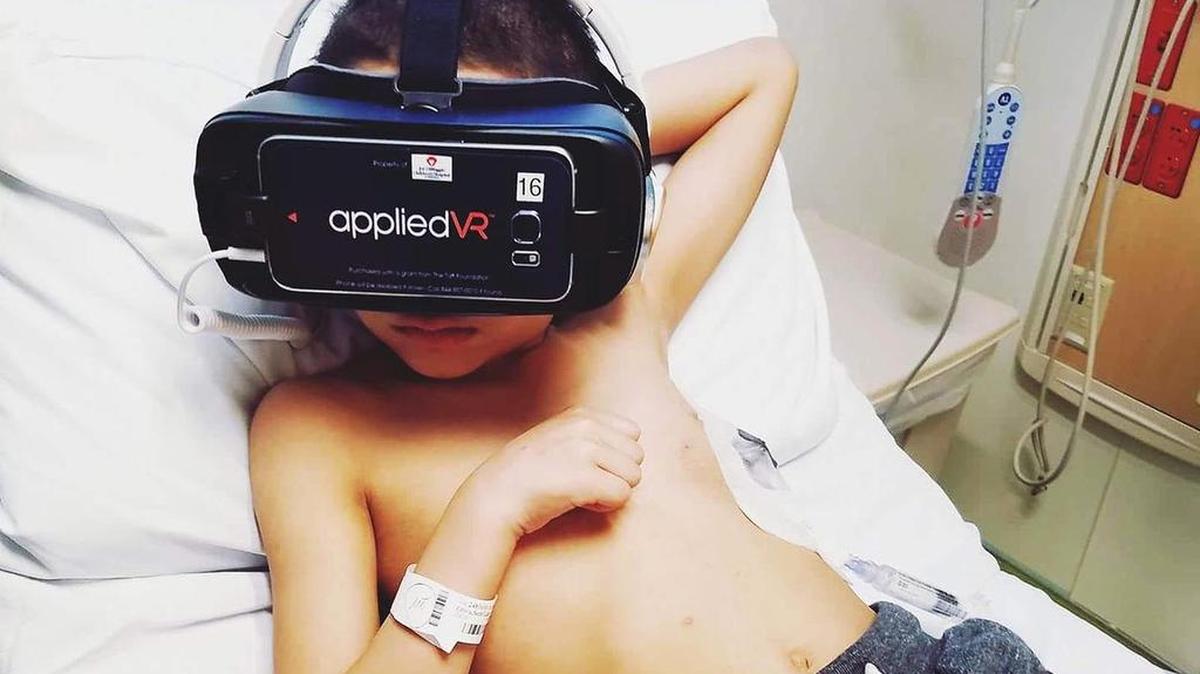 Seth Oliva, 8, is playing a virtual reality game that takes him inside the human body while getting cancer treatment at Joe DiMaggio Children’s Hospital in Hollywood.