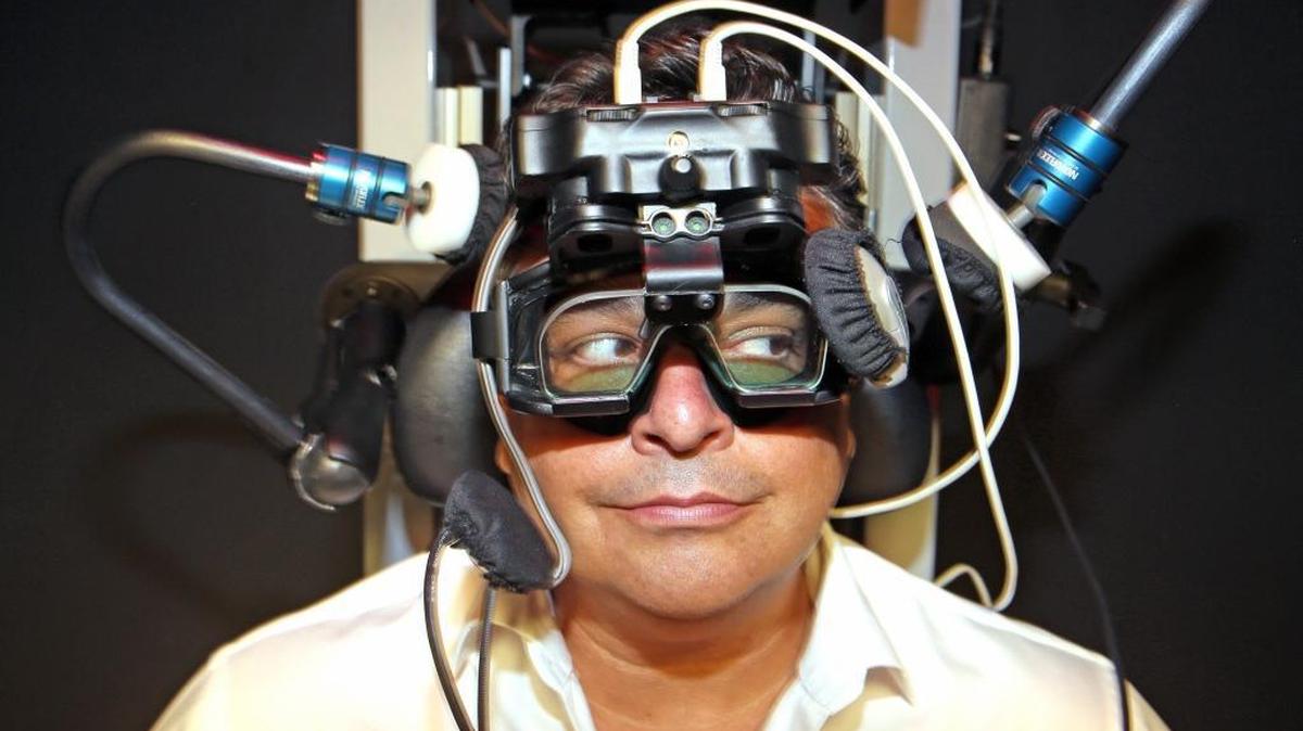 Sean Knowles wears goggles in a special chair used to diagnosis concussions. Several hospitals and clinics around Miami are bringing in new techniques and treatments for concussion treatment and diagnosis.