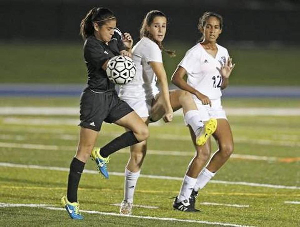 Bari Gold, center, captain of the Palmetto Senior High soccer team, has been treated for concussions at UHealth Sports Medicine.