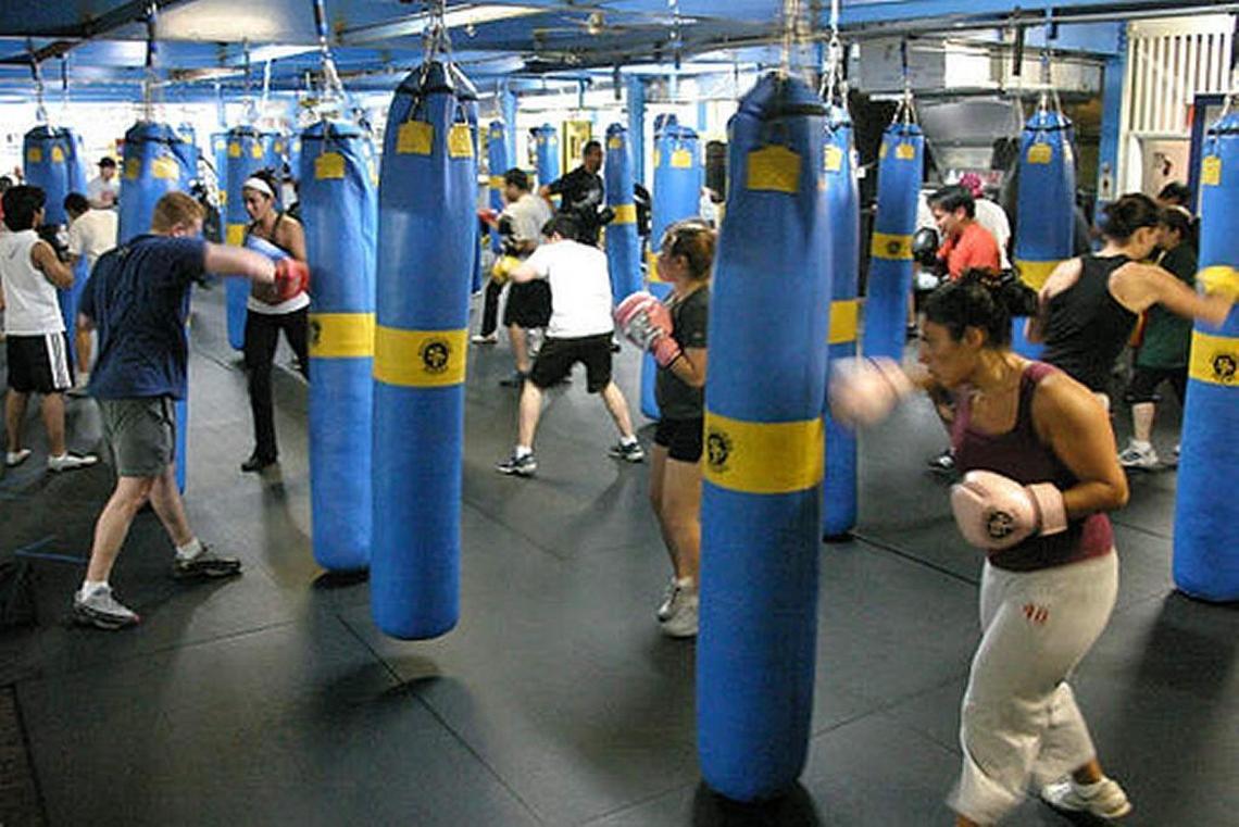 Students take to the boxing bags at South Beach Boxing in Miami Beach.