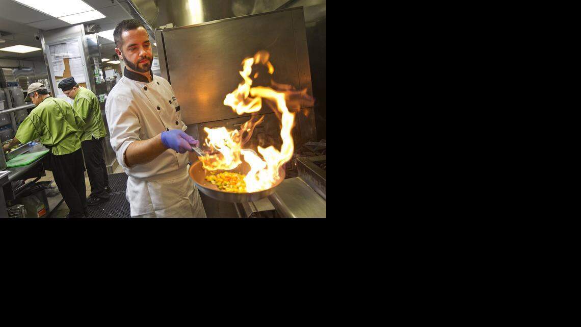
Chef Richard Plasencia is executive chef for Baptist Health. Here he works on a healthier version of a pork loin dish he prepared in his main kitchen at South Miami Hospital.
