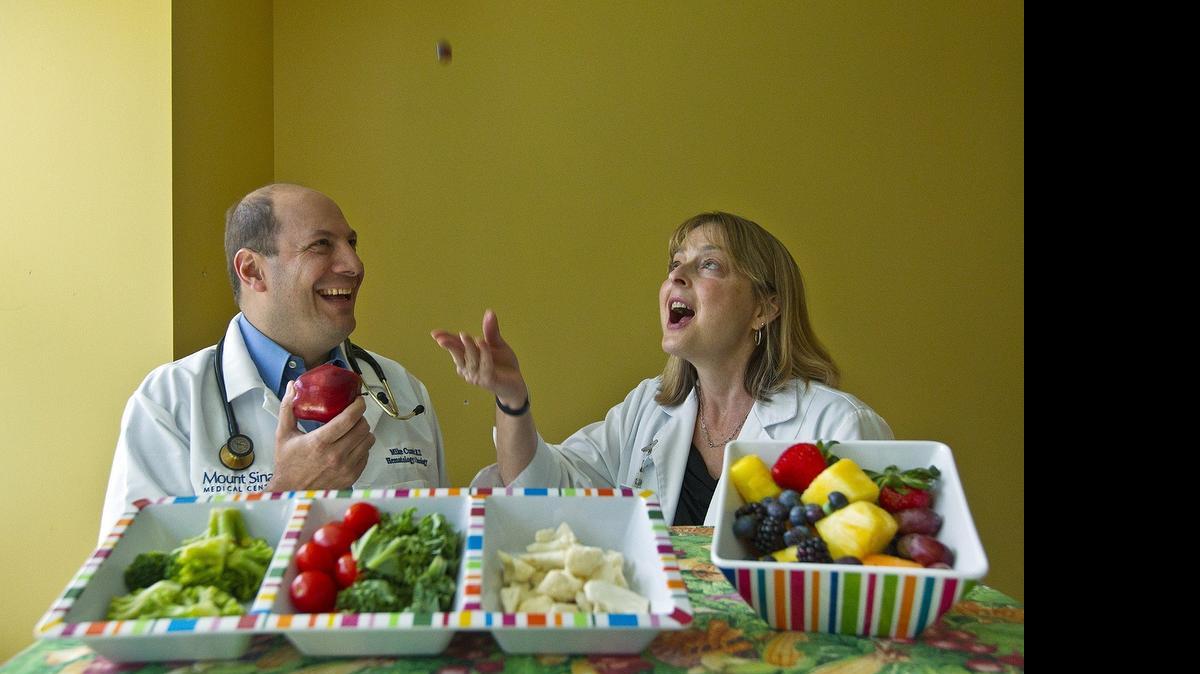 
A healthy diet matters: Dr. Mike Cusnir and oncology dietitian Sandy Sotnick show off some of the foods at Mount Sinai Medical Center that you can eat that will help fight cancer and other chronic diseases.
