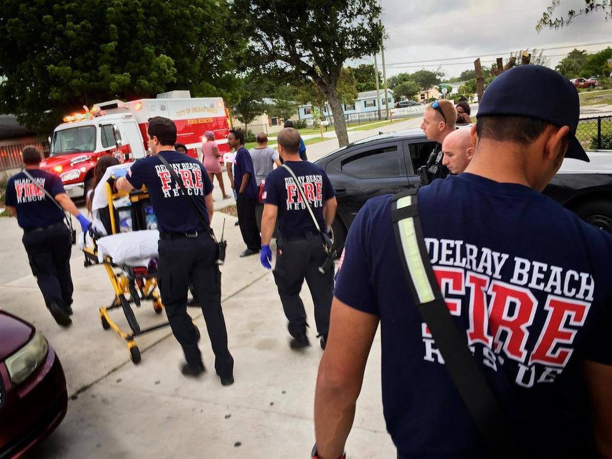 Delray Beach Fire Rescue firefighter-paramedics transport a woman overdosing on heroin to Delray Medical Center on May 19, 2017.