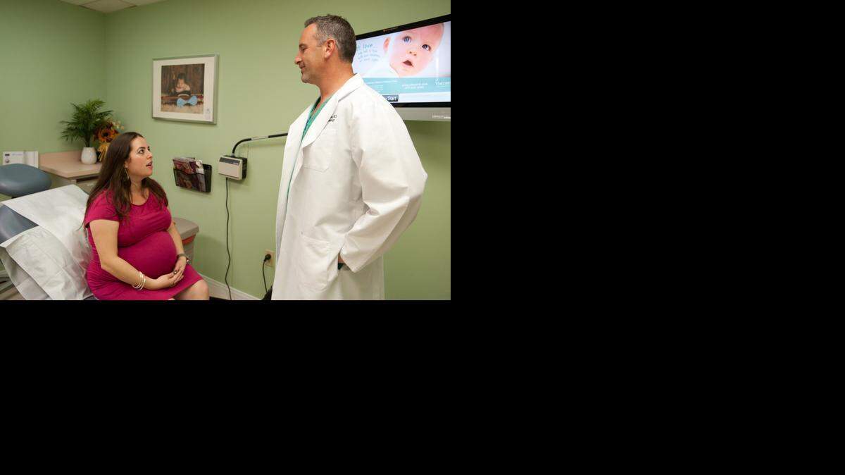 
TREATING GESTATIONAL DIABETES: Melissa Wolf meets with Dr. Jason James, her obstetrician. 


