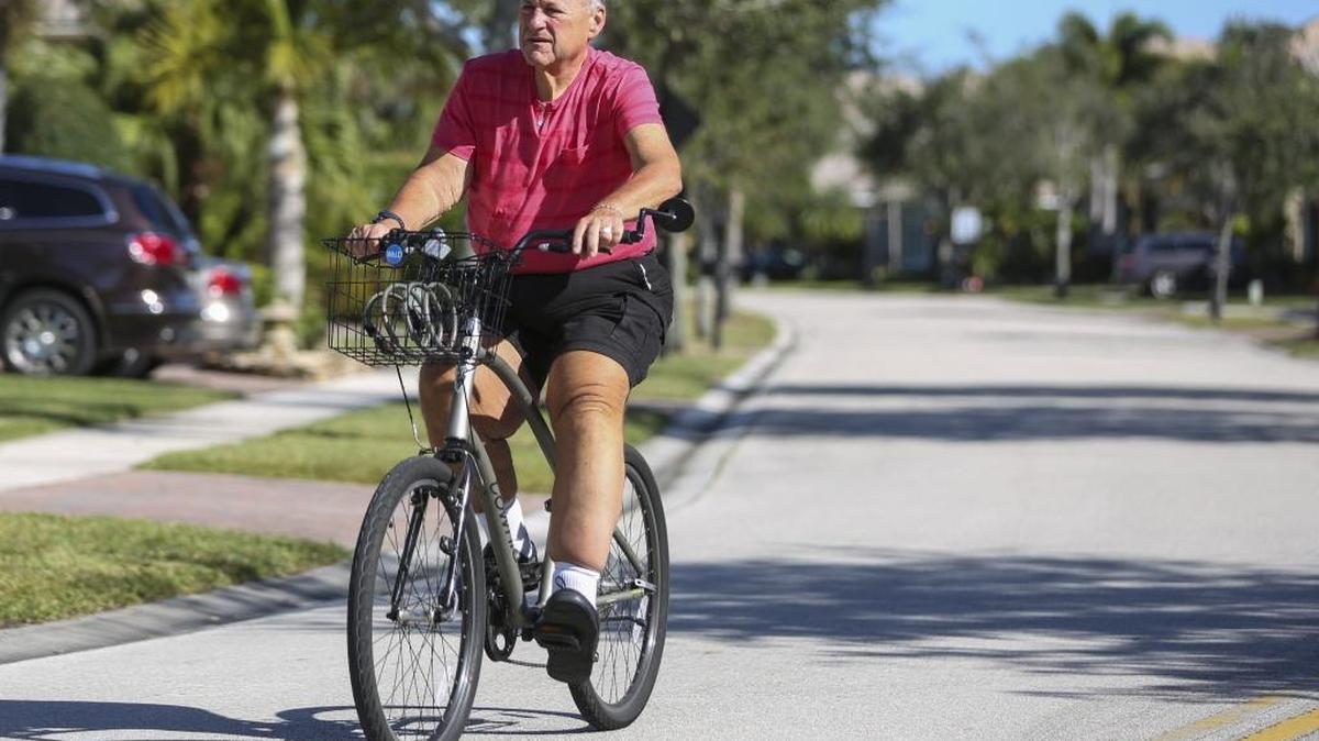 Neil Vogel rides his bike near his home in Parkland. Vogel, who works in corporate financing, lost 185 pounds in two years after being diagnosed with type 2 diabetes. His diabetes is doing much better.