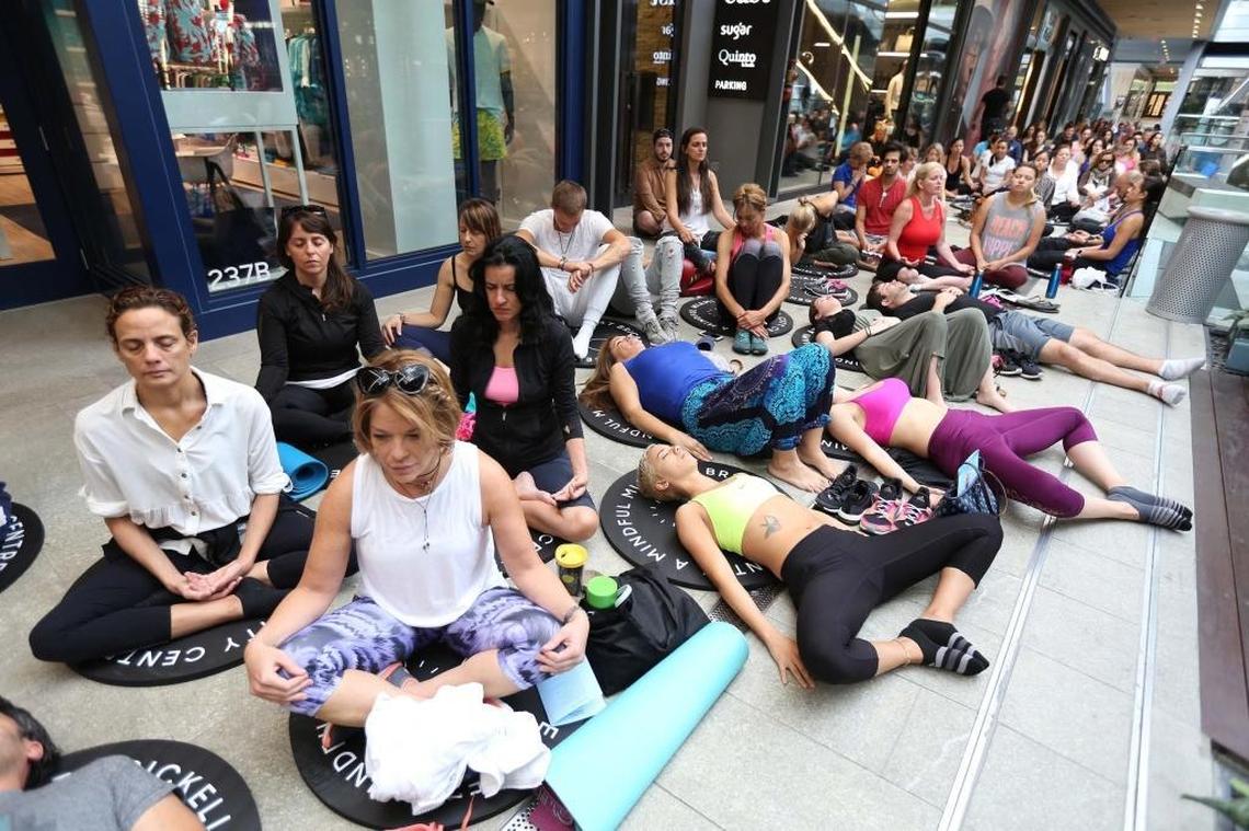 A large group meditated together at Brickell City Centre for Earth Day.
