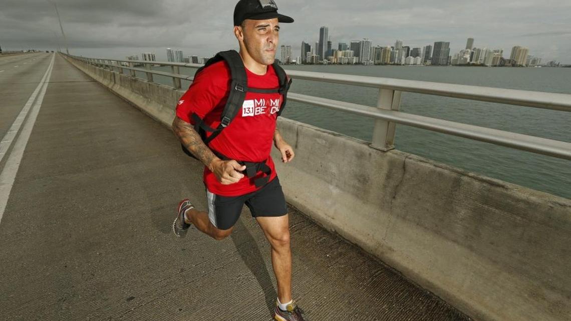 
Firefighter Gabe Arteaga runs along the Rickenbacker Causeway as he trains for a Navy SEALs challenge. He has recovered from ankle surgery on a severe break that normally would have meant his running days were over. 


