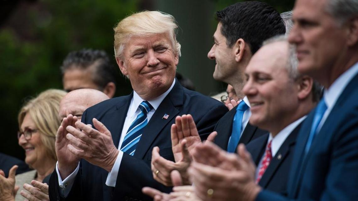President Donald Trump looks to House Speaker Paul Ryan, R-Wis., after the House pushed through a health-care bill on May 4, 2017.