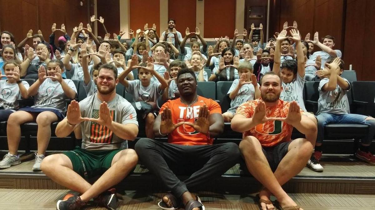 Miami Hurricanes football players KC McDermott, Sunny Odogwu and Nick Linder spoke to elementary school students April 19, 2017, about the importance of staying active and eating healthily.