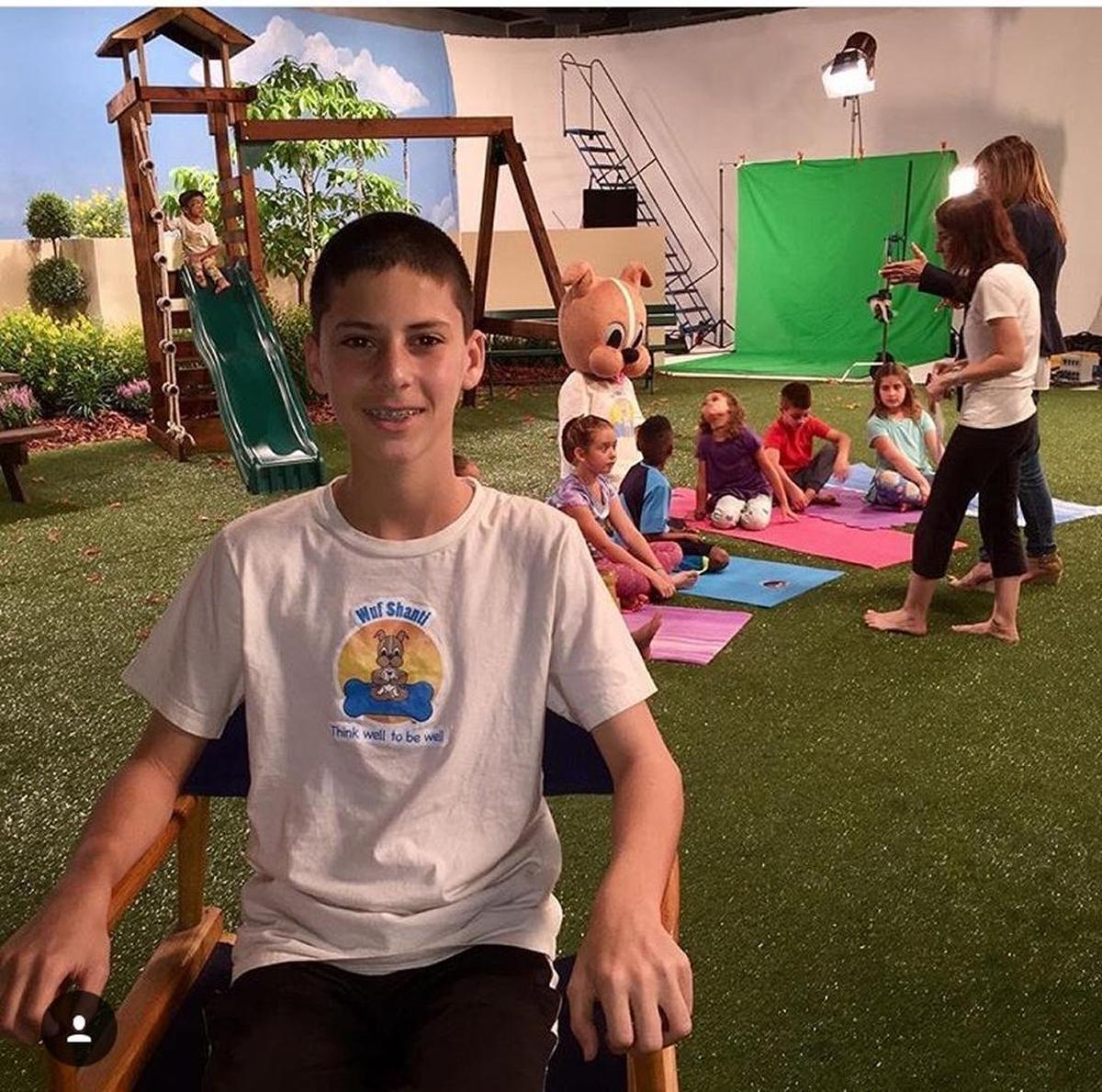Adam Avin, who is one of the youngest certified yoga instructors in Florida, created Wuf Shanti, a life-size dog that performs yoga poses and sings along with children in front of the camera.