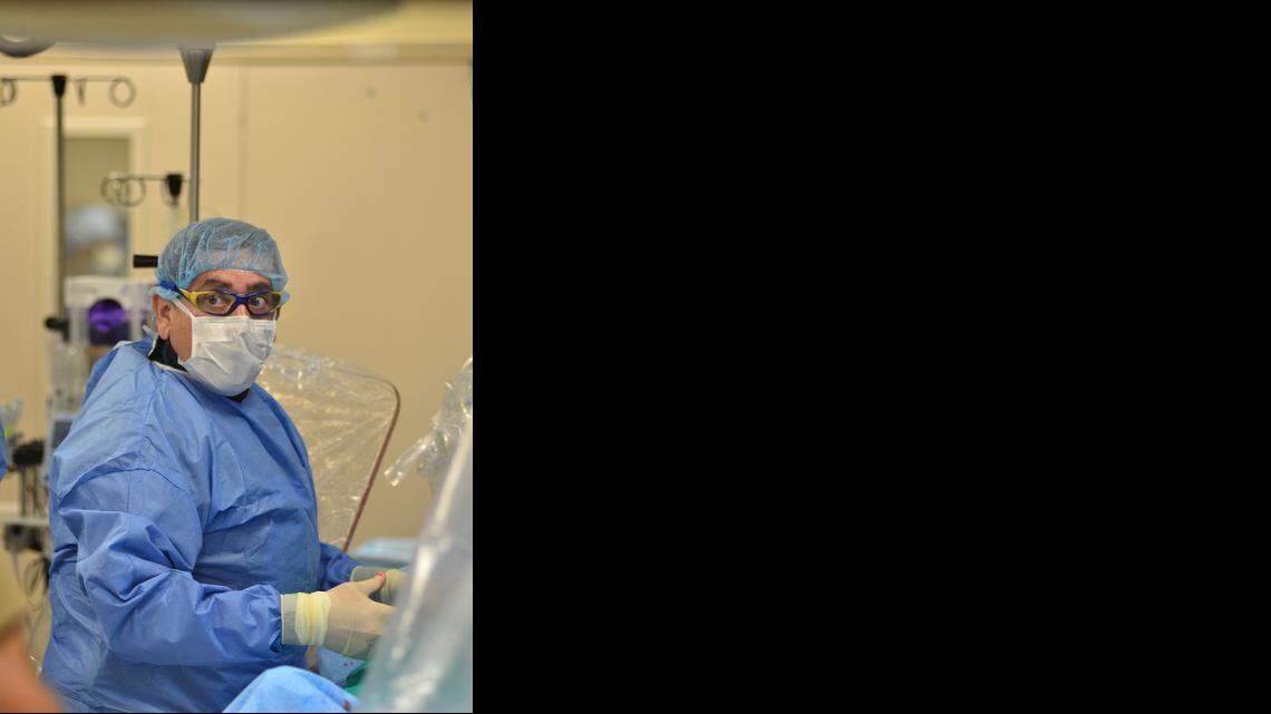  AT BAPTIST HOSPITAL:  Dr. Ramon Quesada, MitraClip expert, works to repair a mitral valve prolapse.