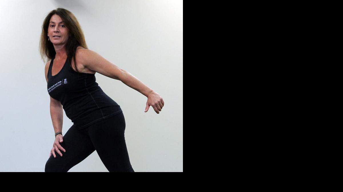
WARM UP: Baptist Health South Florida Community Exercise Instructor Faby Yasky shows five different simple exercises to help folks get healthy in the New Year on Monday January 12, 2015. Here Faby shows the Warm-up and stretching portion of her workouts, where you start by mimicking what your eventual workout will be.
