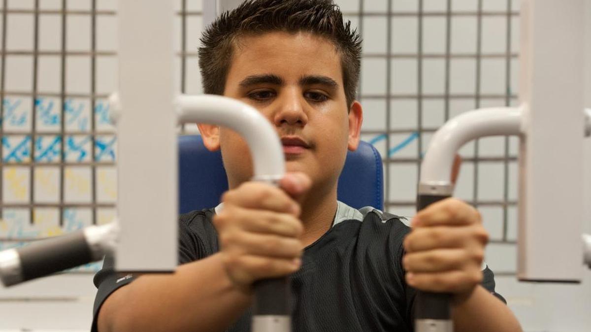 Giovannie Somarriba of Biscayne Park exercises at the University of Miami Miller School of Medicine. He participated in the Crunch Time pediatric nutrition and wellness program at the health center.
