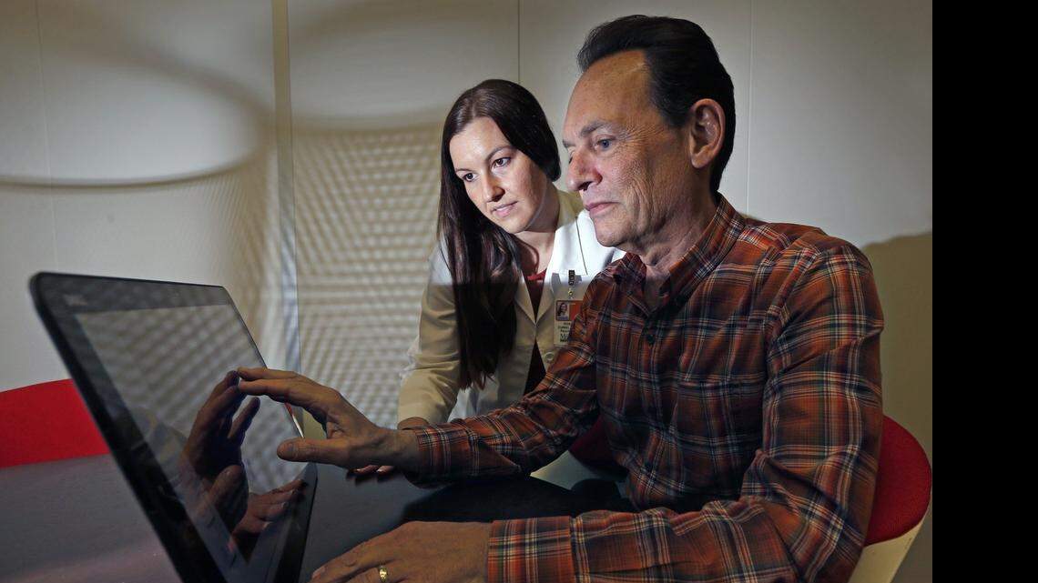 
AT UM CENTER ON AGING: Neuropsychologist Dr. Rosie Curiel, left, is involved in a study of healthy adults ages 63 and older, like Paul Herman, right, to determine if those at risk of Alzheimer’s could be detected before symptoms begin.


