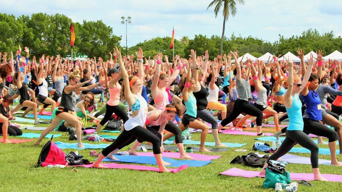 Wanderlust 108 is a “mindful triathlon” that consists of a leisurely 5K, guided yoga, and meditation. The event was held at Virginia Key Beach Park recently.