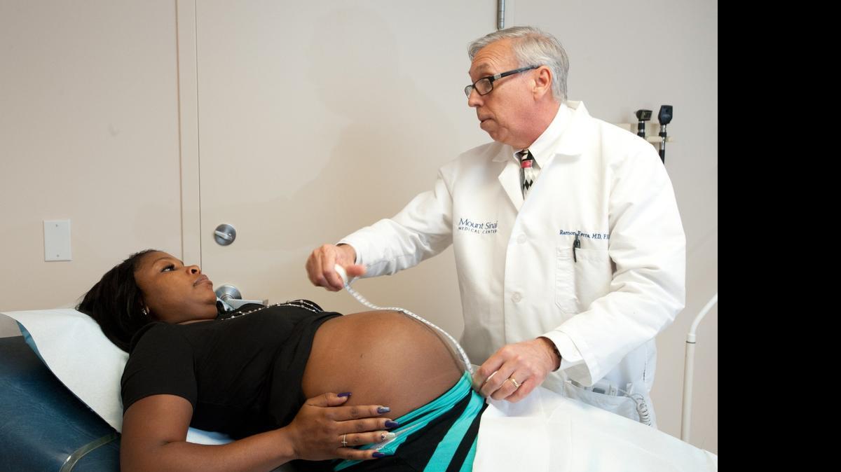 
Shenique Lucdor gets her belly measured by Dr. Ramon Ferra, fellow of the American College of Obstetricians and Gynecologists, at Mount Sinai Aventura on June 12, 2015.
