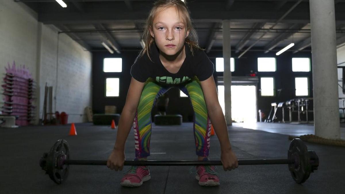 Milla Star Bizzotto, 9, trains at her father’s gym, Focus Movement Academy, in Miami Shores. She competed in a BattleFrog 24- hour obstacle race in hopes of inspiring kids to eat healthy and be more active.