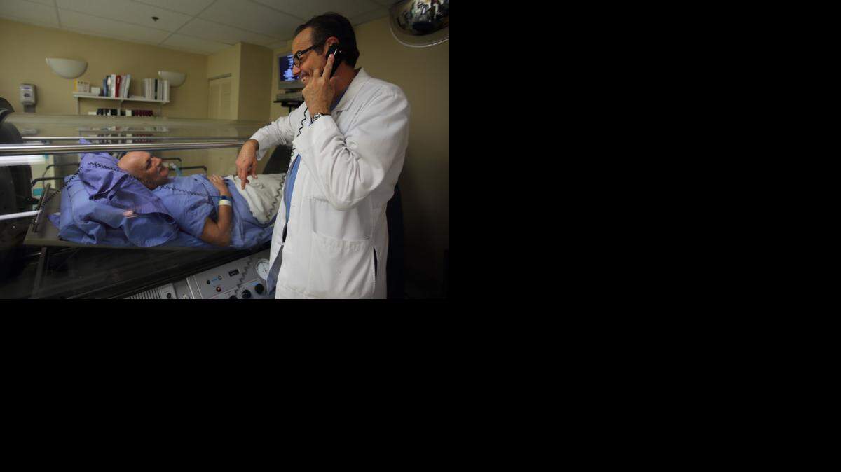
Dr. Brett Cohen, chief of bariatric surgery at Memorial Regional Hospital and Memorial Hospital Pembroke, tends to a surgical case. 
