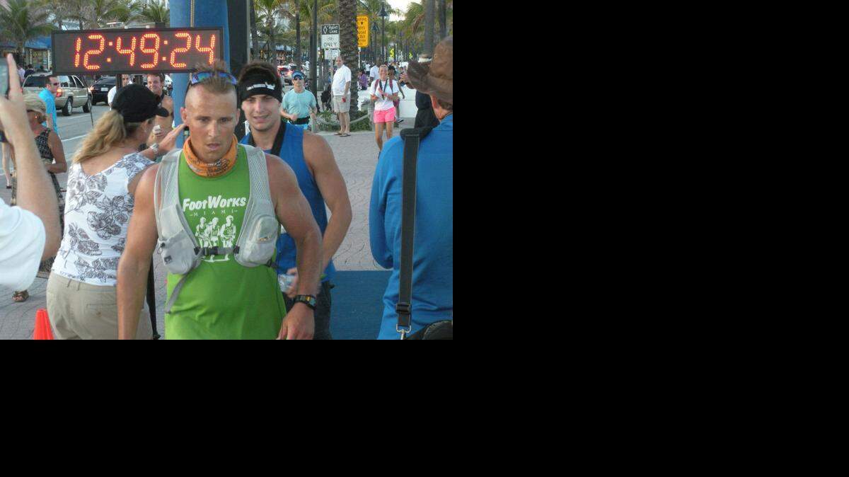 
Brian Thomas, 35, of Lake Worth finishing a 100K run in 2011. He was preparing for an 1,800-mile run from Florida to Michigan with his group, Road Warriors, to raise money for cancer patients.
