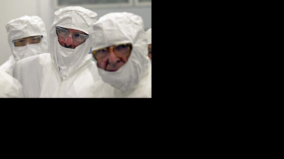 
Thomas J. LeBlanc, (center) provost of The University of Miami, gets a tour of The Dr. John T. Macdonald Foundation Biomedical Nanotechnology Institute at UM (BioNIUM), as they celebrated the opening of a nanofabrication facility on Wednesday January 27, 2015.
