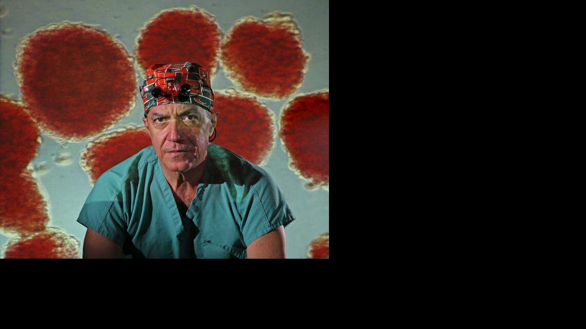 
AT DIABETES RESEARCH INSITUTE: Dr. Camillo Ricordi with islets (cell clusters in the pancreas that produce insulin) projected behind.  Some patients who’ve had islet cell transplants don’t have to take insulin.



